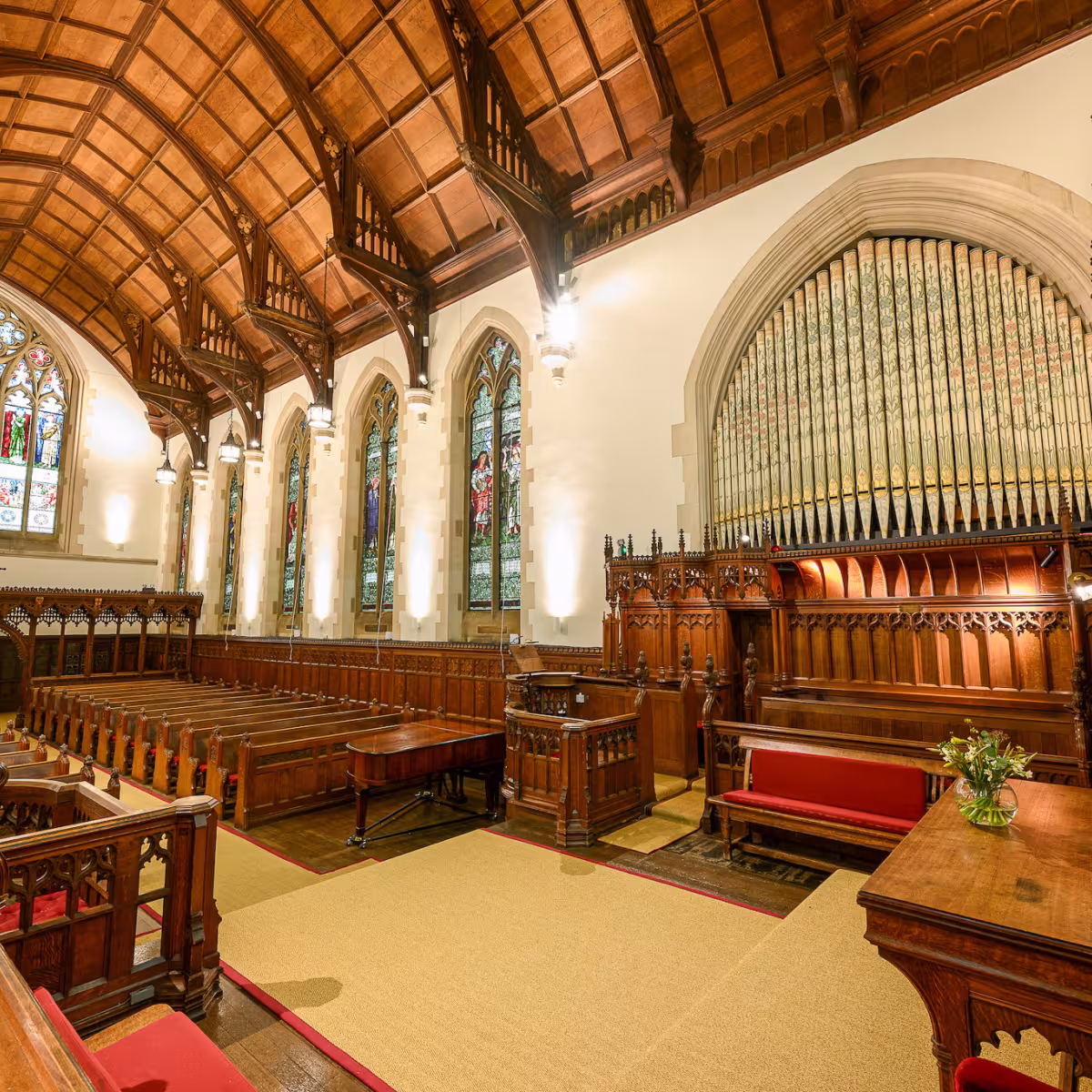 Harris Manchester College chapel, looking towards the South Windows with the oainted organ pipes